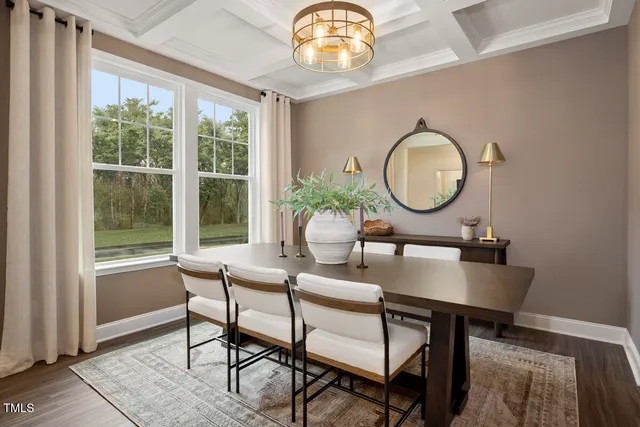 a large kitchen with kitchen island a sink table and chairs