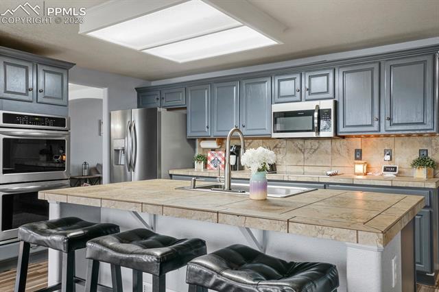 12130 Rio Secco Road Peyton, CO 80831 - Photo 16 of 40 Large Breakfast Island