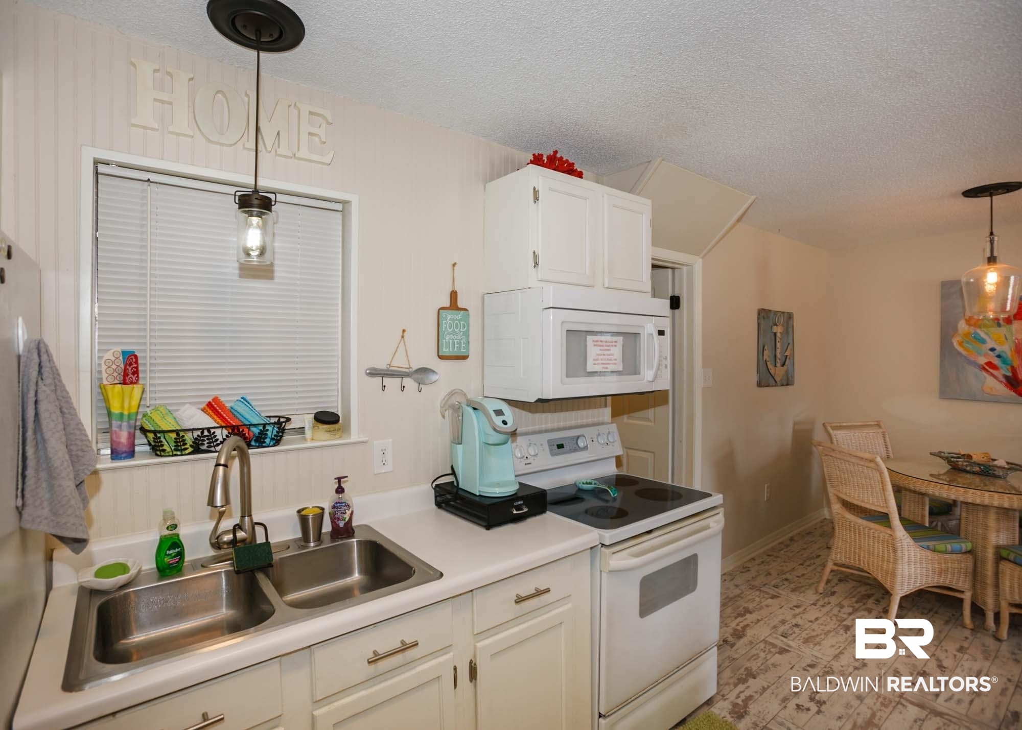 18753 County Road 12 Foley, AL 36535 - Photo 11 of 39 Kitchen featuring a textured ceiling, white appliances, sink, and hanging light fixtures
