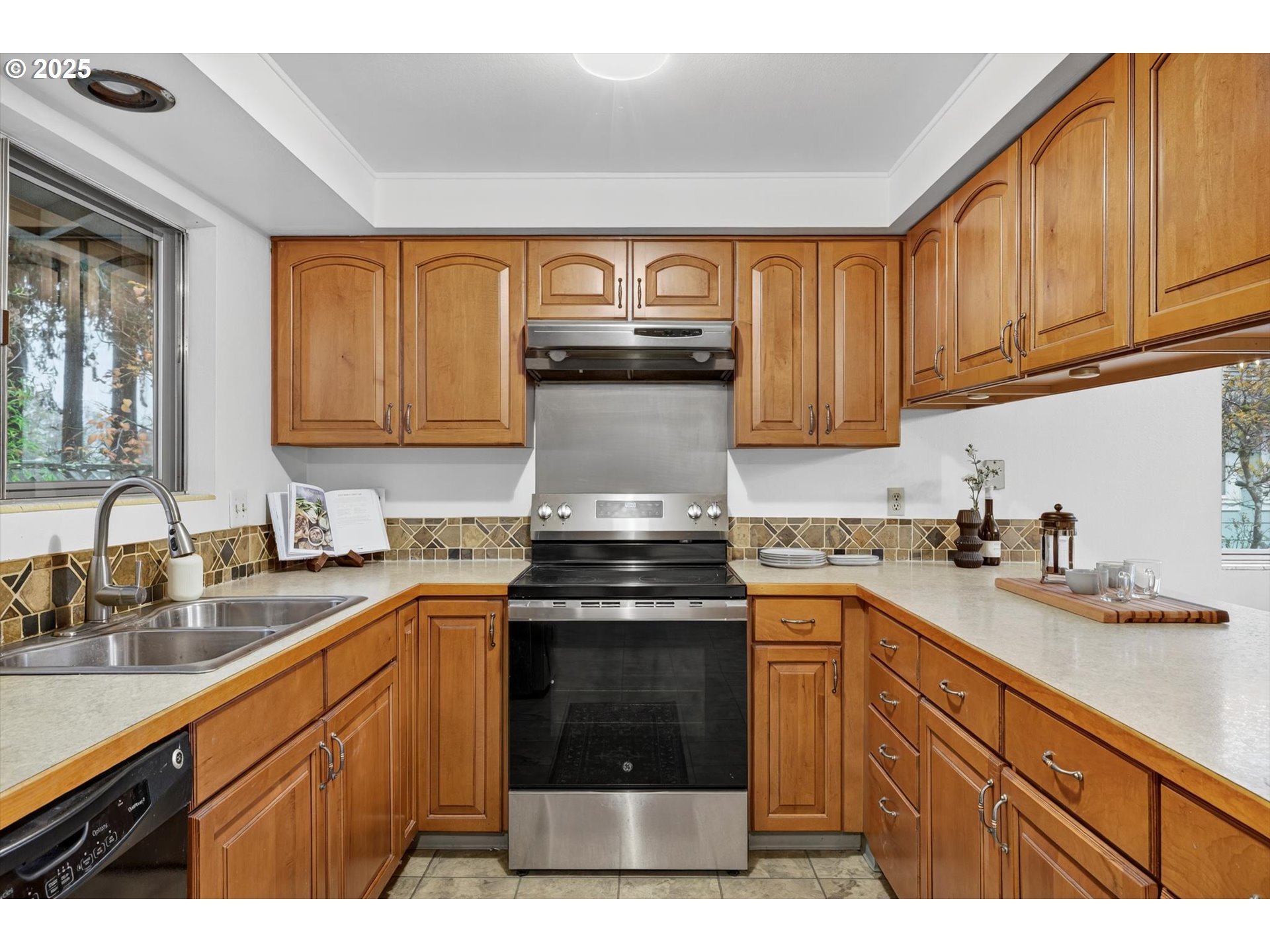 1204 North Elliott Road Newberg, OR 97132 - Photo 14 of 32 a kitchen with stainless steel appliances granite countertop a stove sink and cabinets