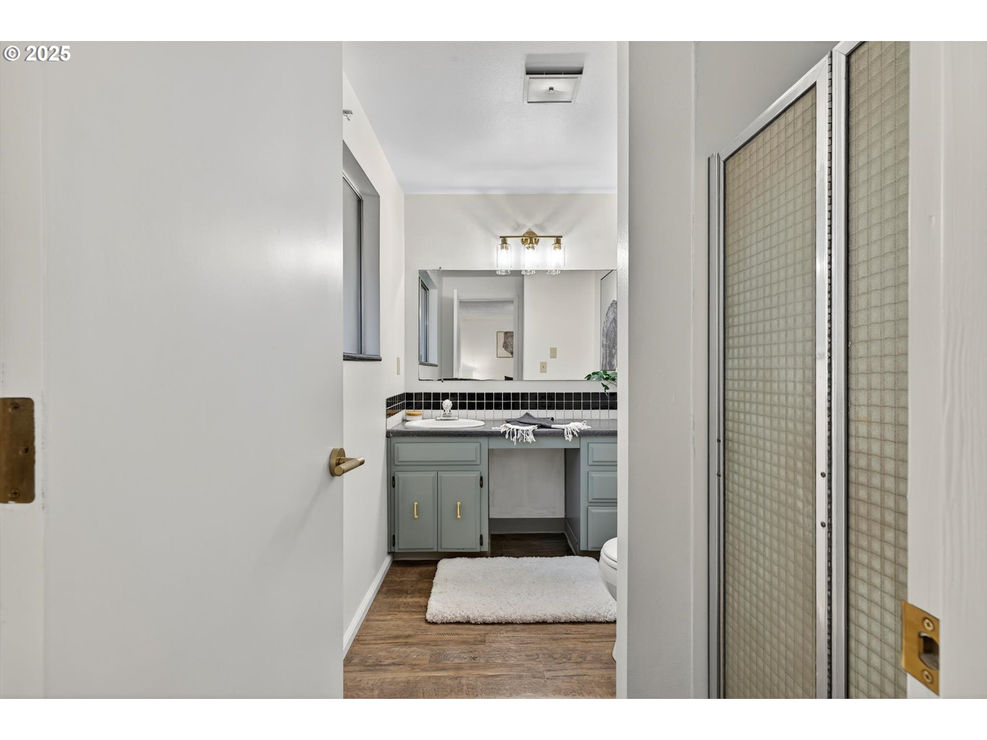 1204 North Elliott Road Newberg, OR 97132 - Photo 19 of 32 a kitchen with kitchen island a sink stainless steel appliances and cabinets