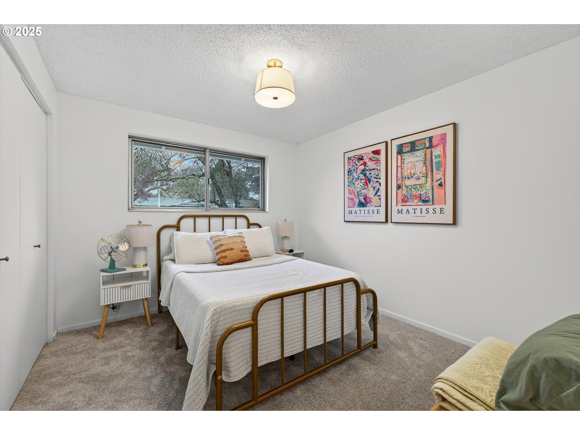 1204 North Elliott Road Newberg, OR 97132 - Photo 22 of 32 a bedroom with a bed and a painting on the wall