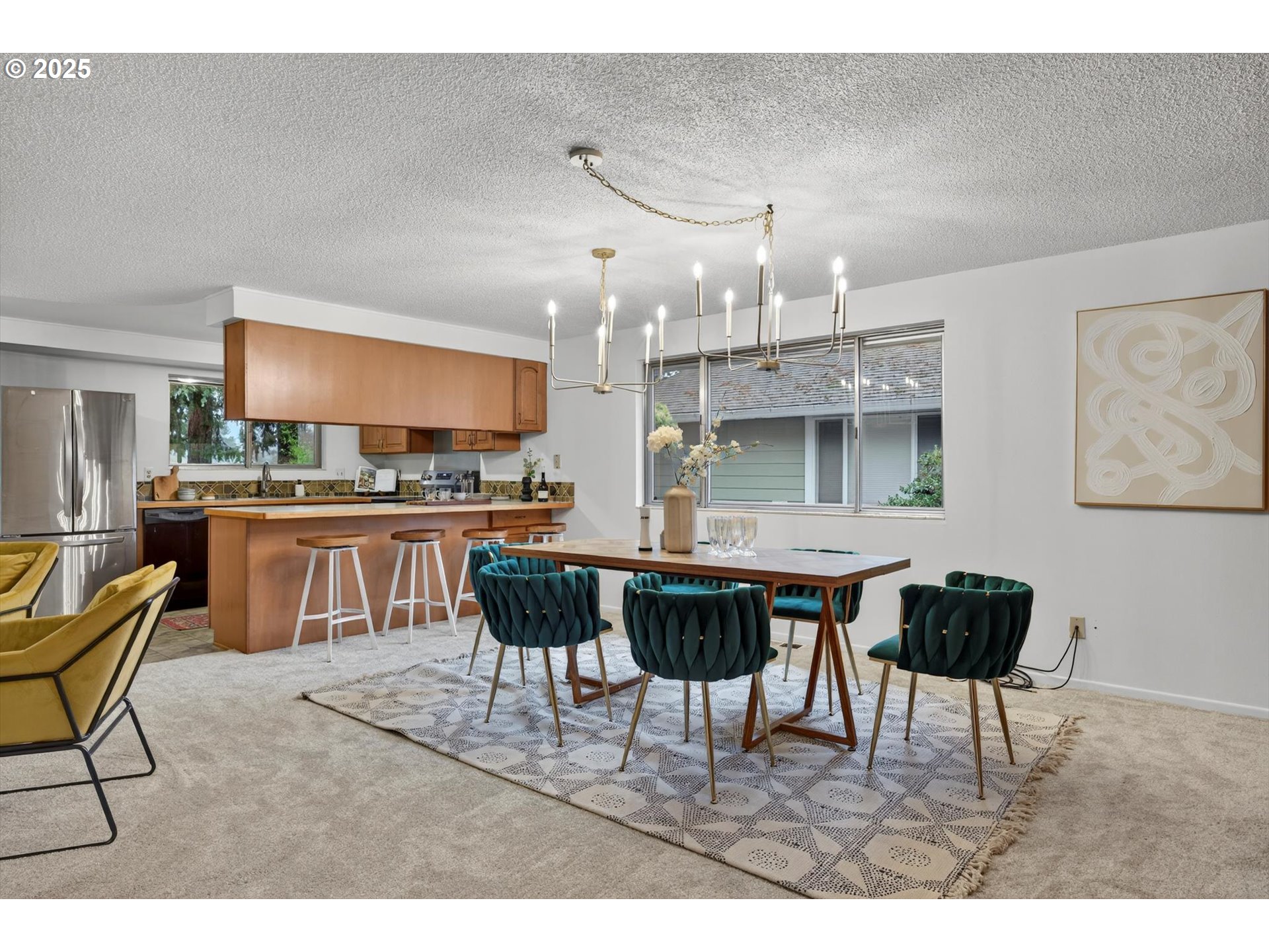 1204 North Elliott Road Newberg, OR 97132 - Photo 8 of 32 a living room with stainless steel appliances kitchen island a table and chair