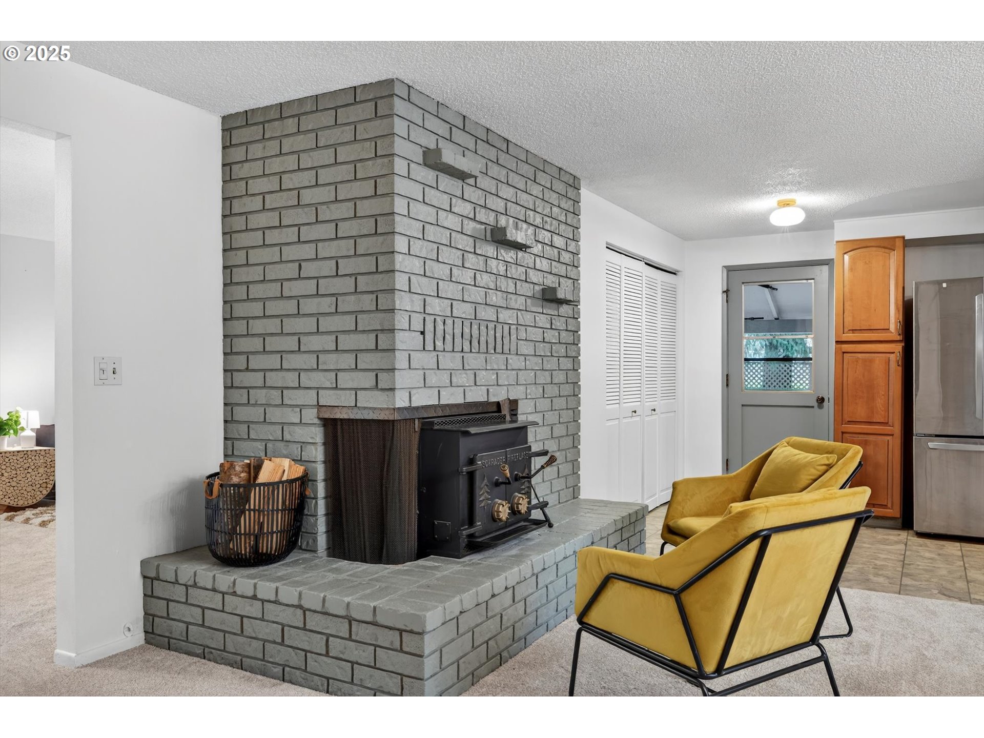1204 North Elliott Road Newberg, OR 97132 - Photo 10 of 32 a bedroom with furniture and a fireplace