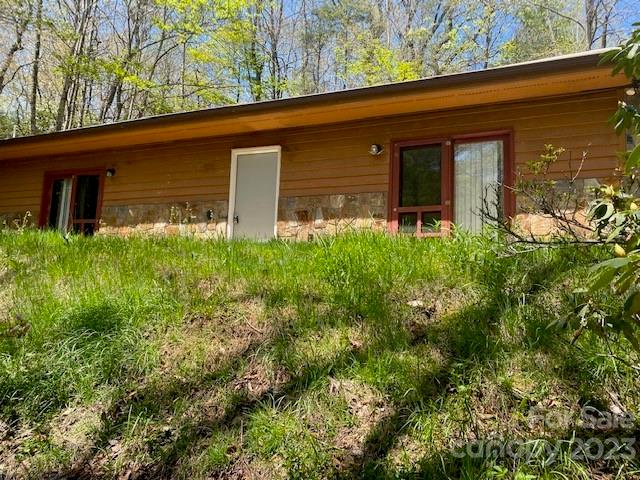 a view of a house with a tree