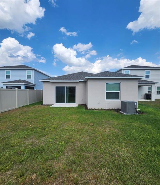 208 Acorn Road Haines City, FL 33844 - Photo 2 of 14 a backyard of a house with lots of green space