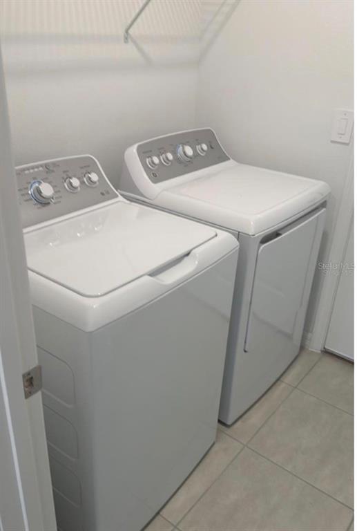 208 Acorn Road Haines City, FL 33844 - Photo 6 of 14 a utility room with dryer and washer