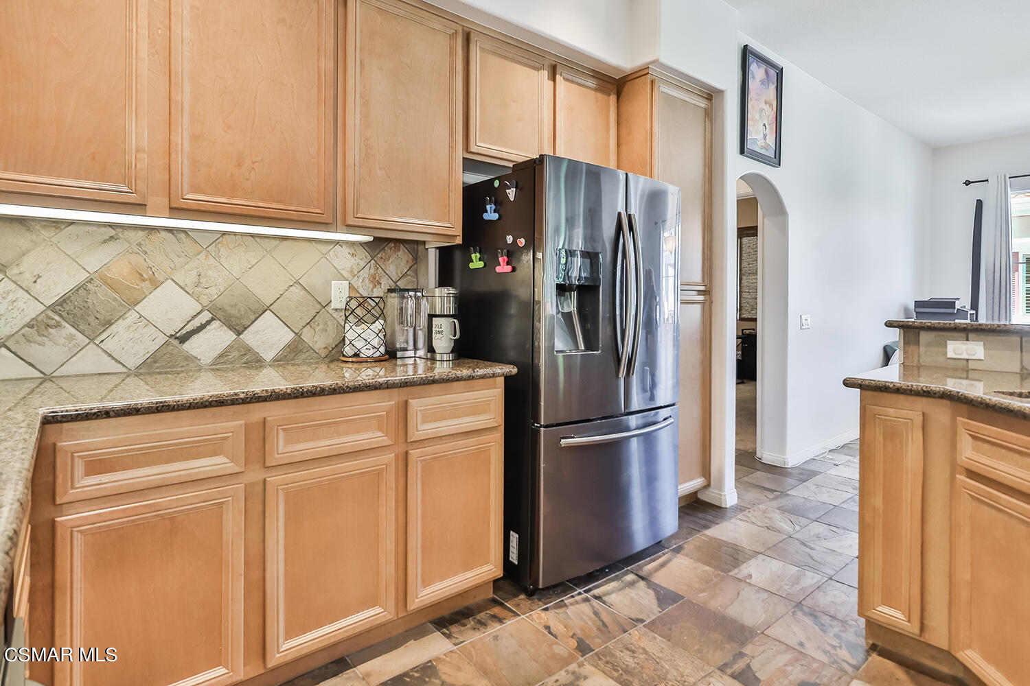 4106 Laredo Lane, Unit A Simi Valley, CA 93063 - Photo 11 of 42 a kitchen with stainless steel appliances granite countertop a refrigerator and a sink