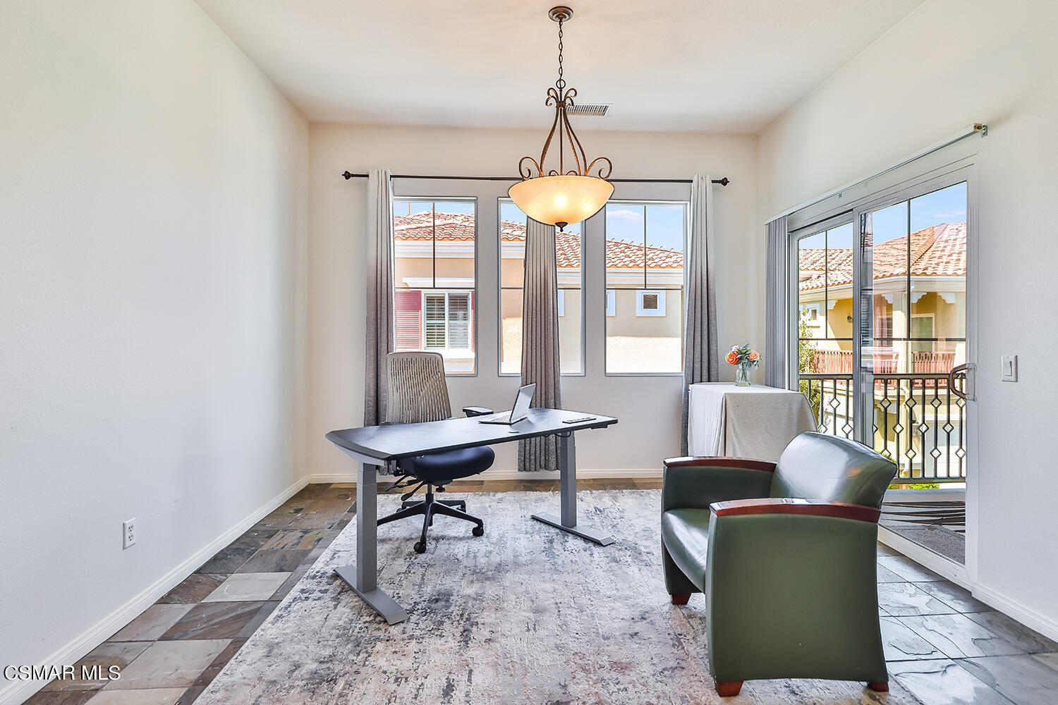 4106 Laredo Lane, Unit A Simi Valley, CA 93063 - Photo 12 of 42 a dining room with furniture a chandelier and wooden floor