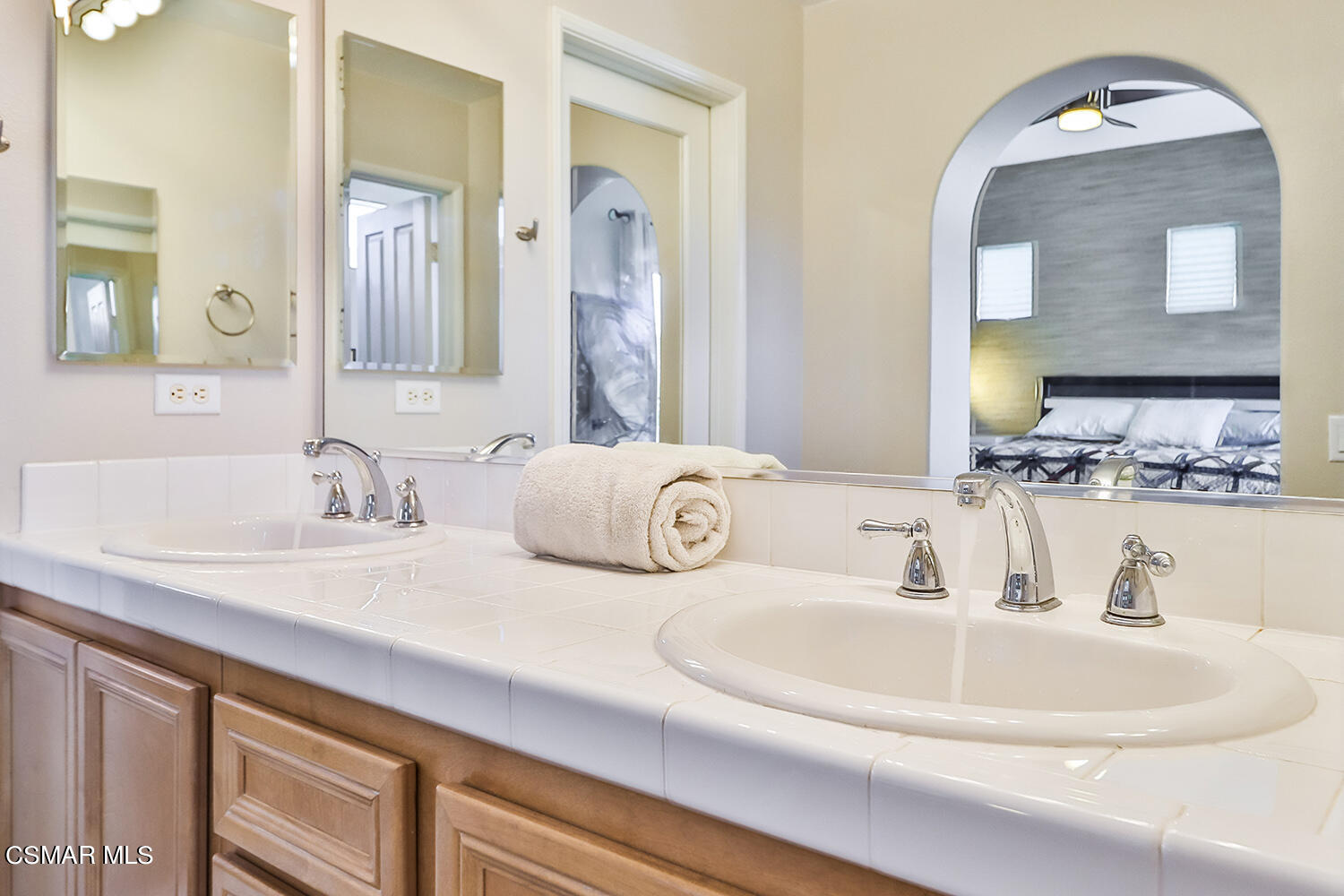 4106 Laredo Lane, Unit A Simi Valley, CA 93063 - Photo 27 of 42 a bathroom with double vanity sinks and a mirror
