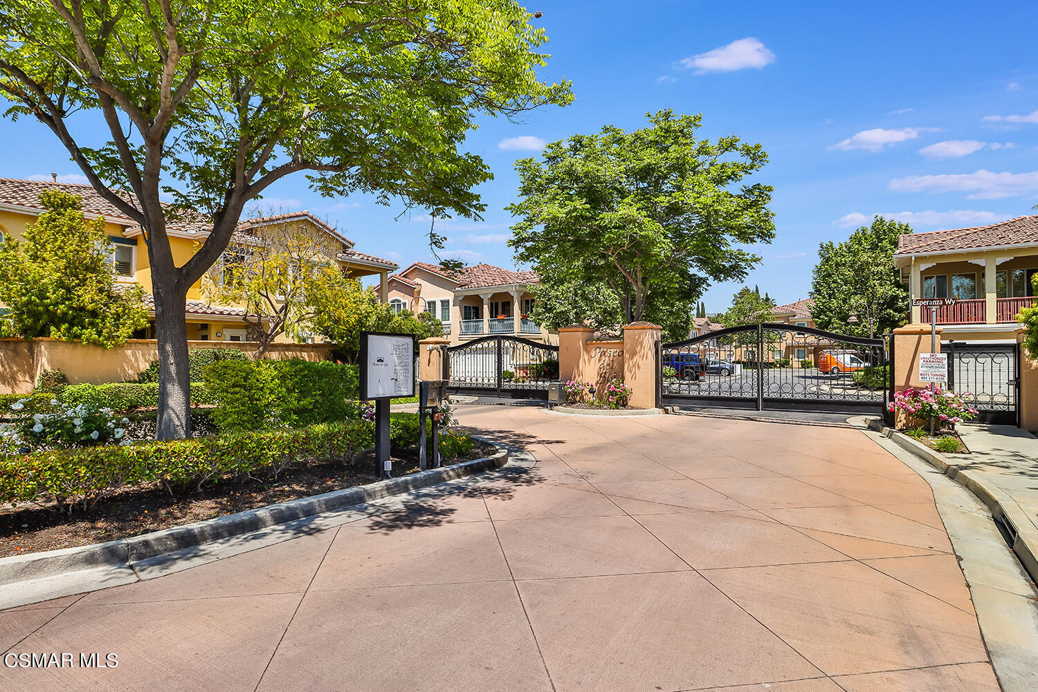 4106 Laredo Lane, Unit A Simi Valley, CA 93063 - Photo 38 of 42 a front view of a house with a yard and tree s