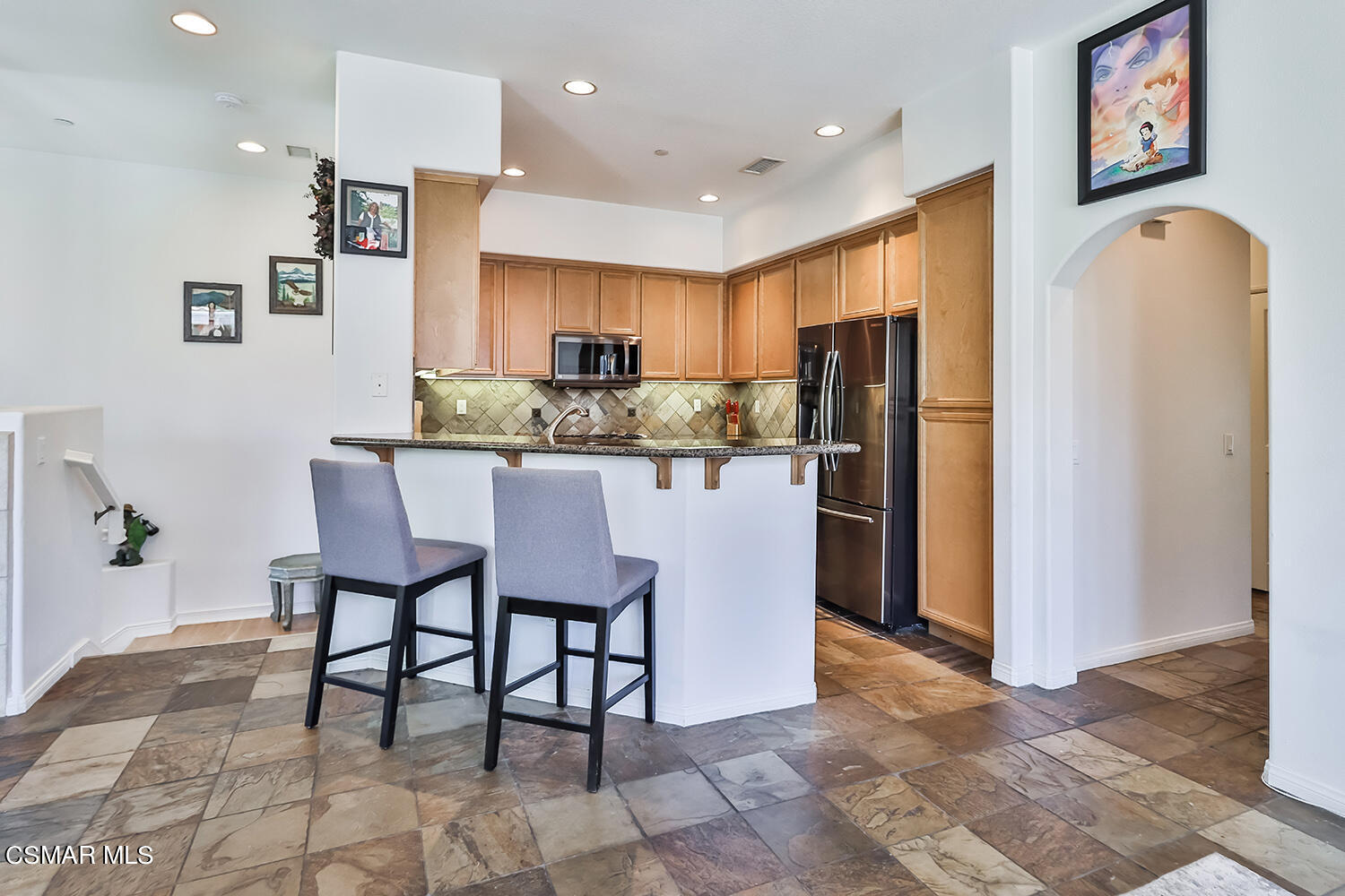4106 Laredo Lane, Unit A Simi Valley, CA 93063 - Photo 7 of 42 a kitchen with stainless steel appliances granite countertop a refrigerator and a stove top oven