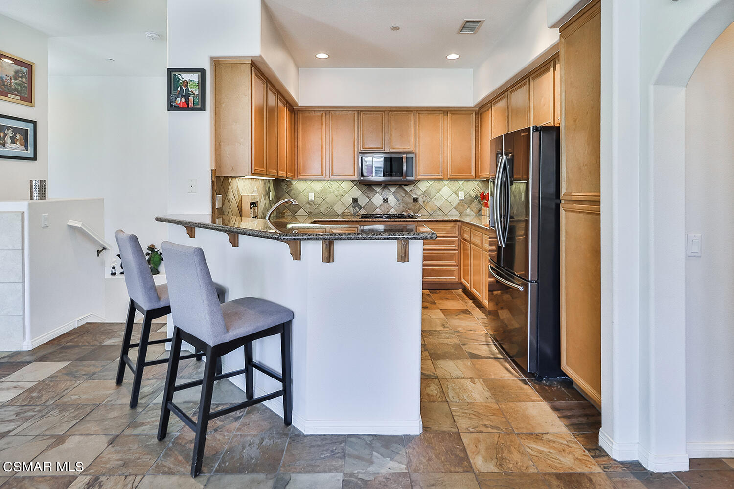 4106 Laredo Lane, Unit A Simi Valley, CA 93063 - Photo 8 of 42 a kitchen with stainless steel appliances granite countertop a refrigerator a sink a stove and island