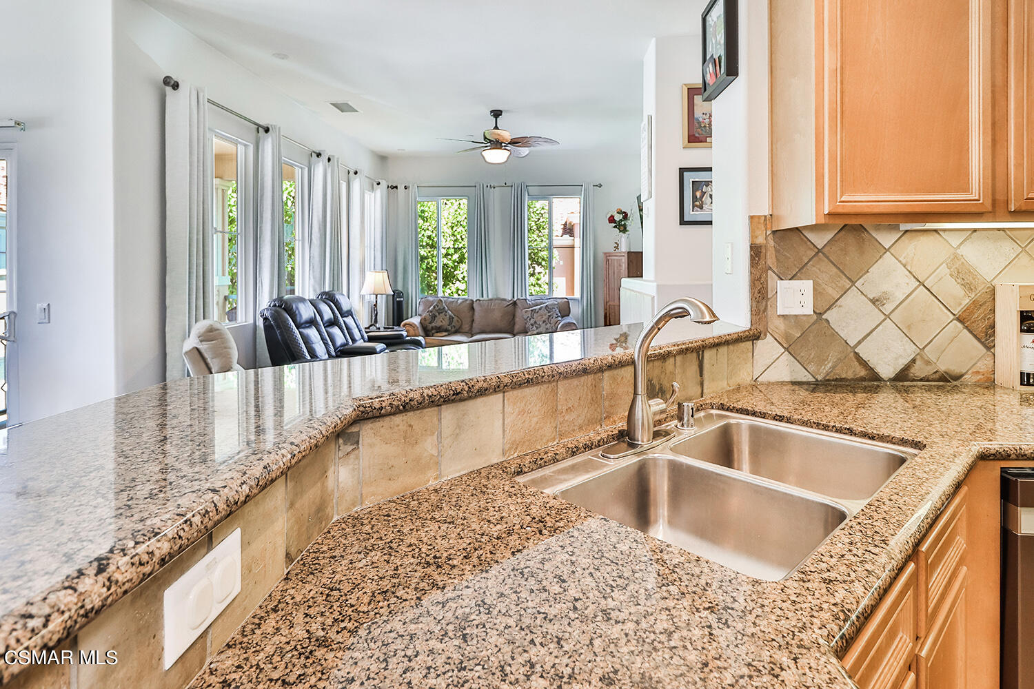 4106 Laredo Lane, Unit A Simi Valley, CA 93063 - Photo 10 of 42 a view of a kitchen with kitchen island a large window and sink