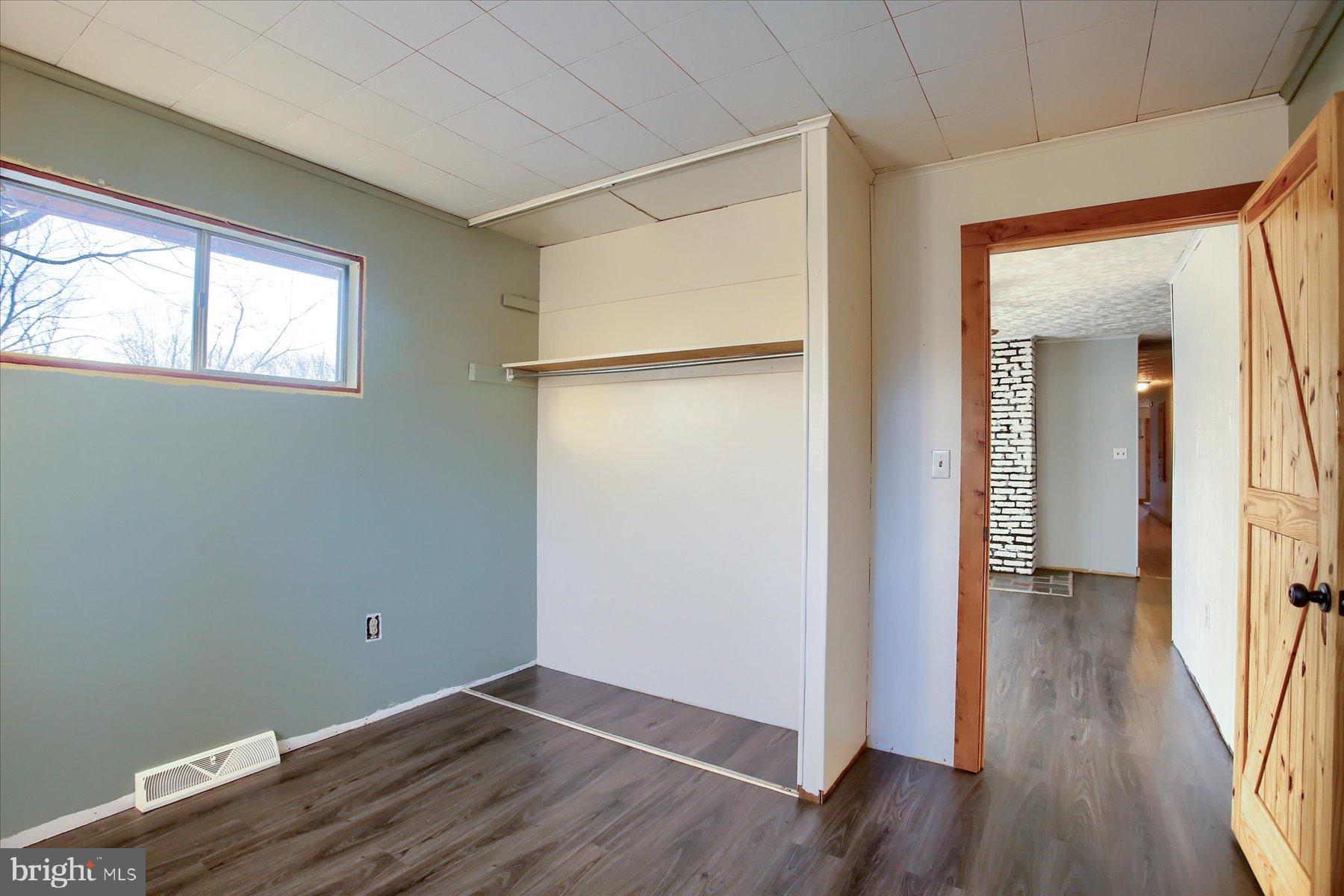 5404 Laurie Lane Enola, PA 17025 - Photo 16 of 29 an empty room with wooden floor and a window