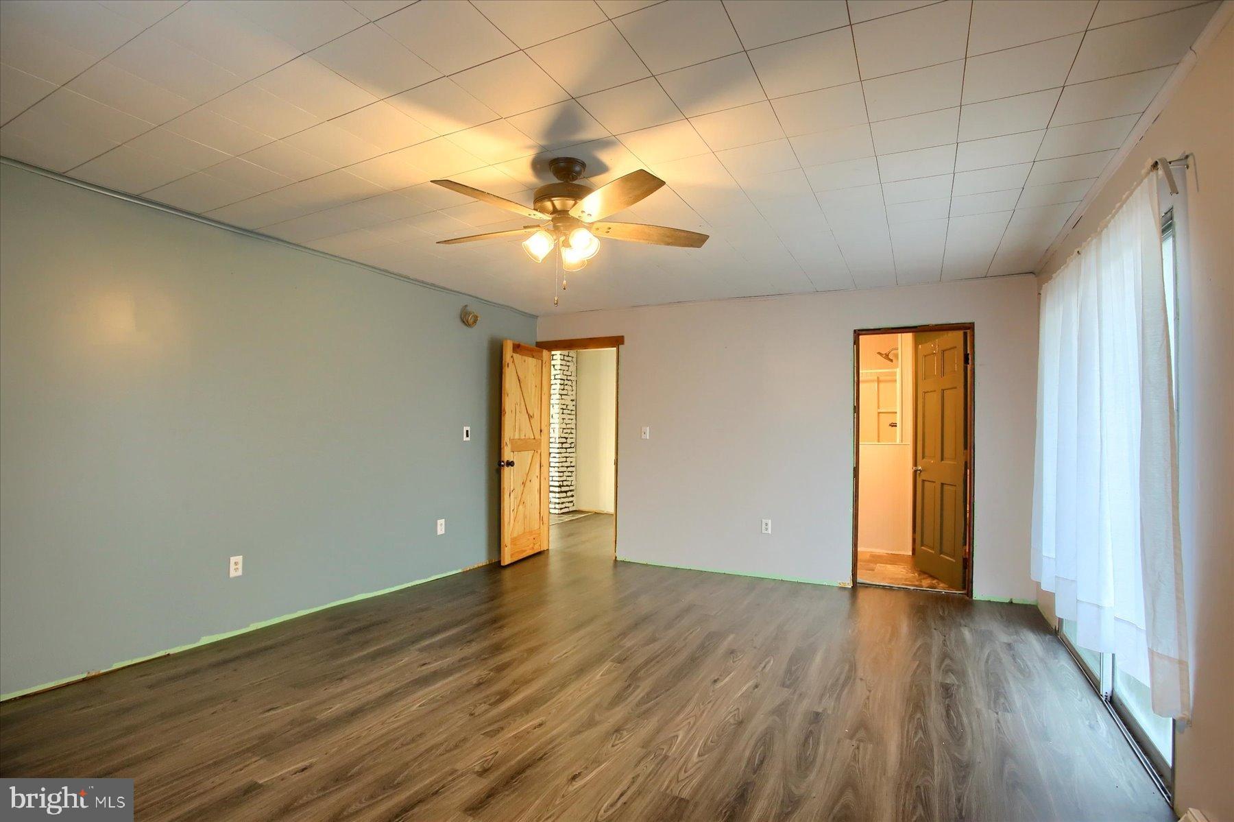 5404 Laurie Lane Enola, PA 17025 - Photo 18 of 29 wooden floor in an empty room with a window