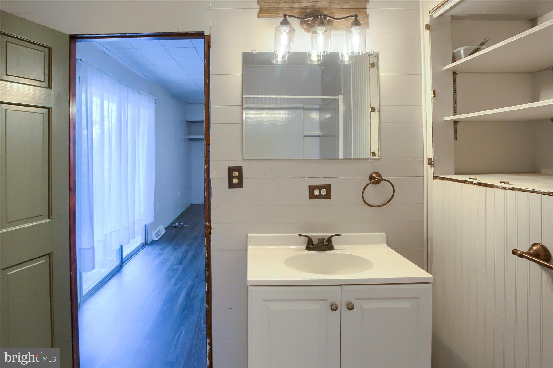 5404 Laurie Lane Enola, PA 17025 - Photo 20 of 29 a bathroom with a sink and mirror