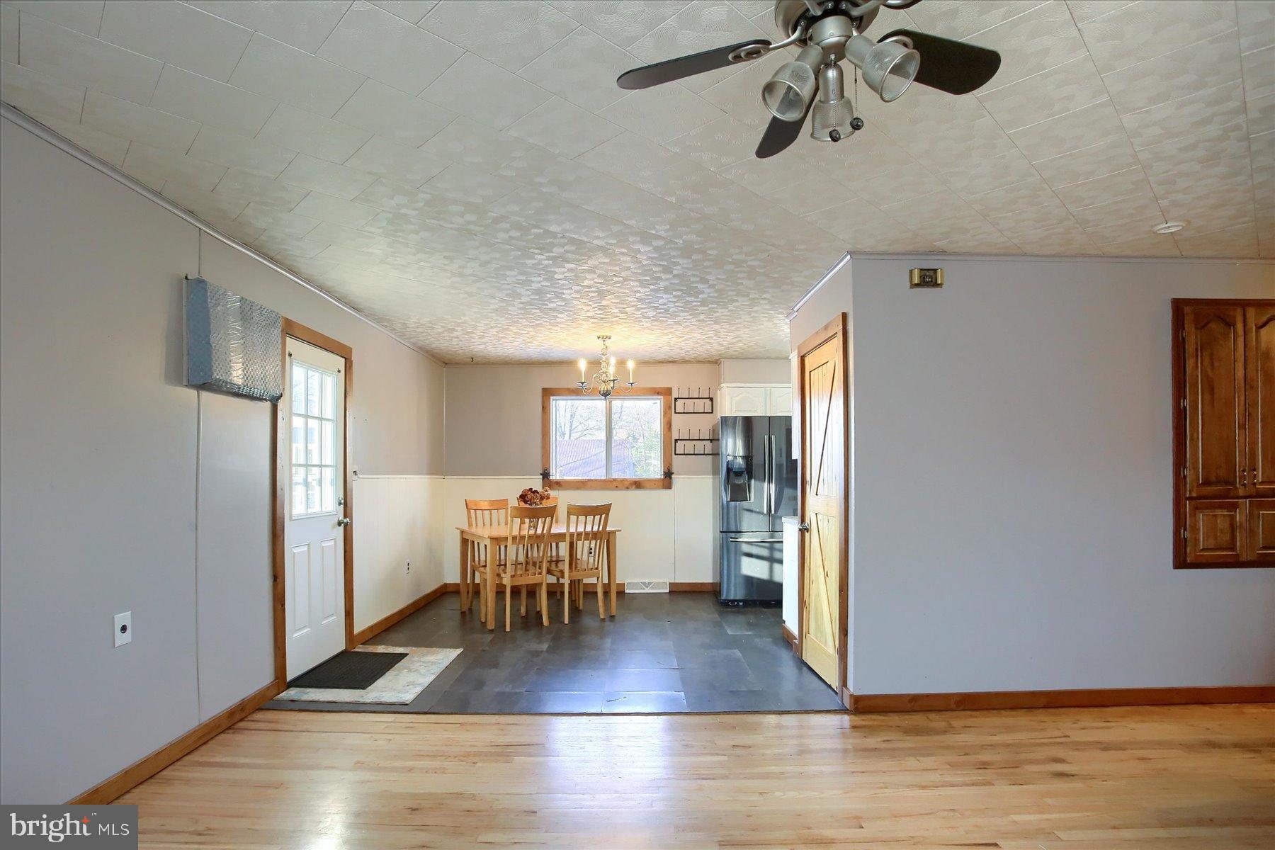 5404 Laurie Lane Enola, PA 17025 - Photo 4 of 29 a view of a livingroom with furniture wooden floor and chandelier