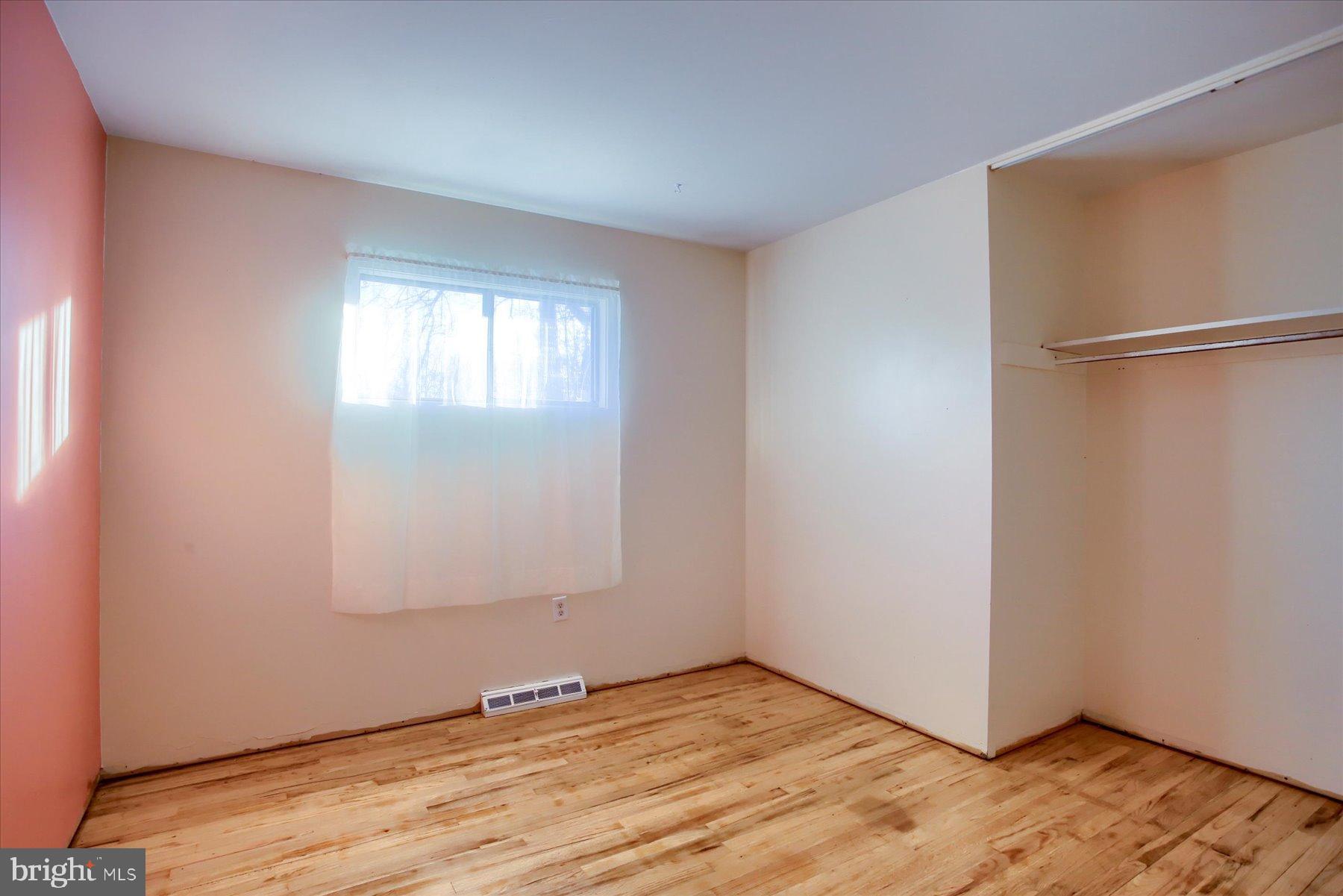 5404 Laurie Lane Enola, PA 17025 - Photo 9 of 29 a view of an empty room with wooden floor and a window