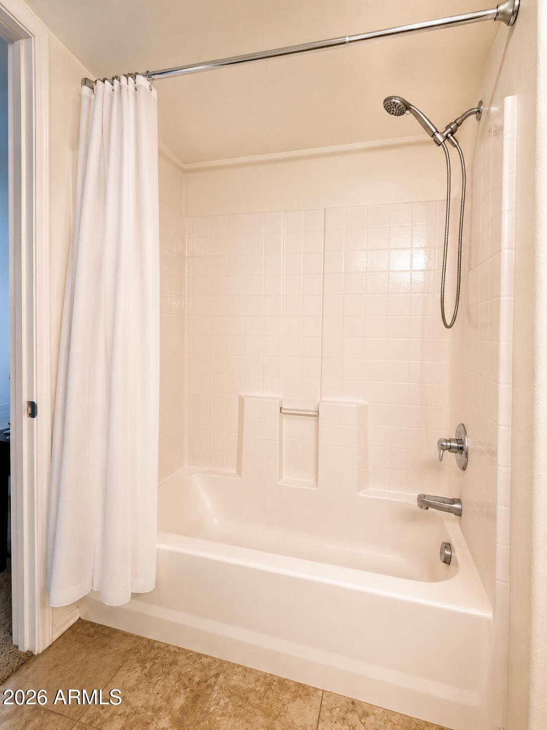 2150 West Alameda Road, Unit 1020 Phoenix, AZ 85085 - Photo 30 of 35 a bathroom with a shower and a bath tub