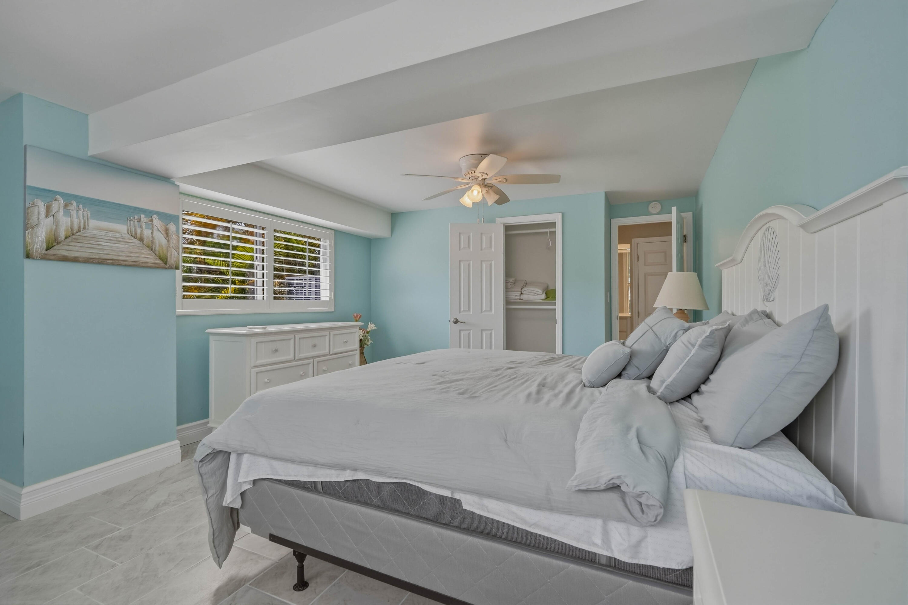 320 5th Street Key Colony Beach, FL 33051 - Photo 42 of 53 a bedroom with a bed and wooden floor