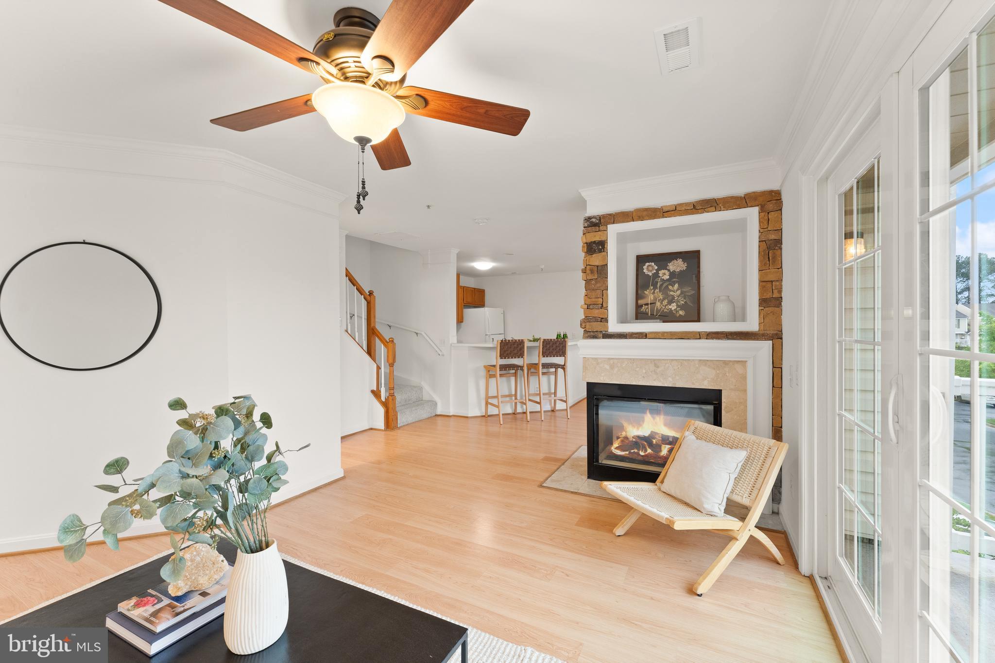 21777 Baldwin Square, Unit 301 Sterling, VA 20164 - Photo 4 of 33 a living room with furniture and a fireplace