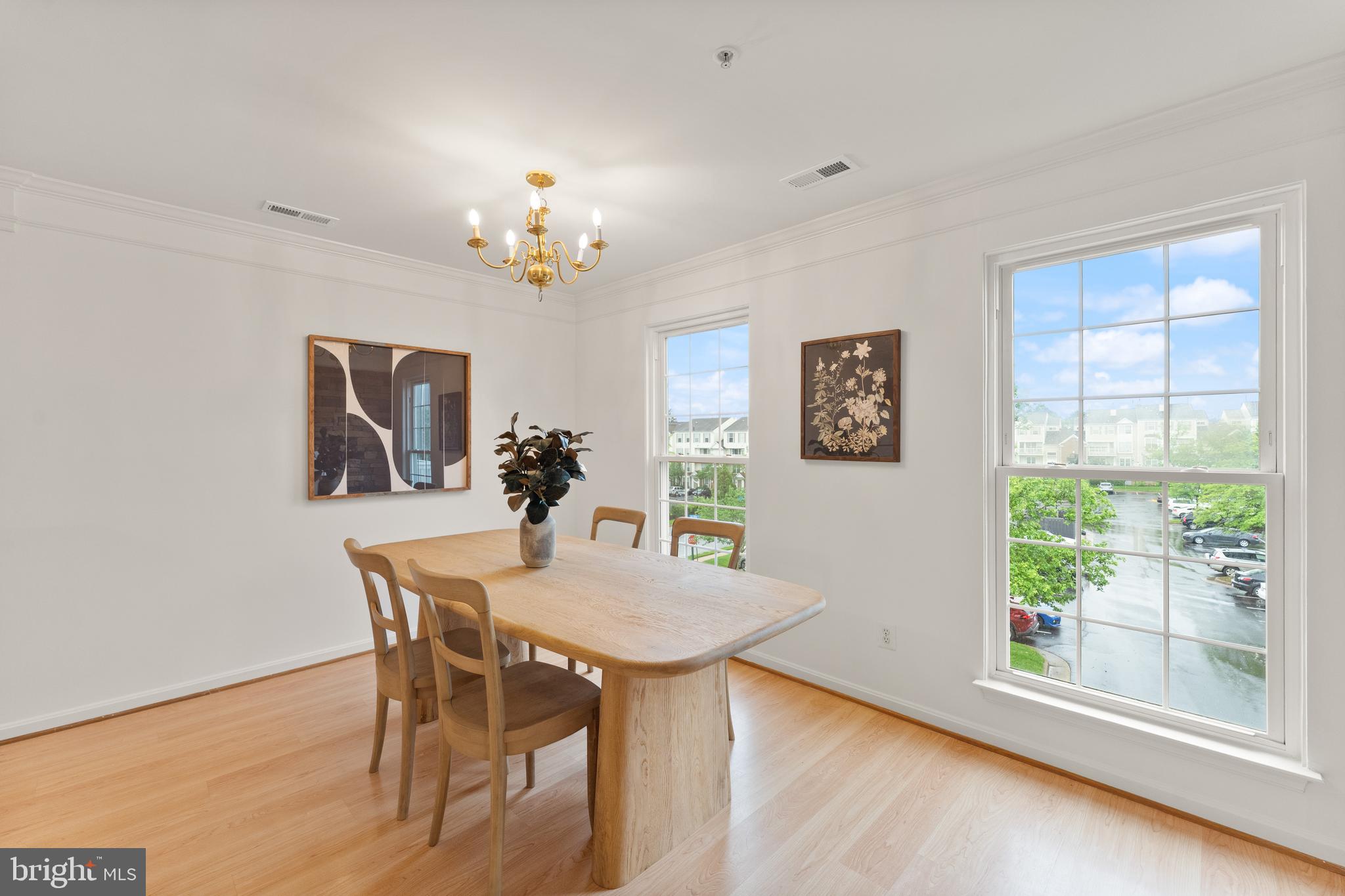 21777 Baldwin Square, Unit 301 Sterling, VA 20164 - Photo 6 of 33 a view of a dining room with furniture window and wooden floor