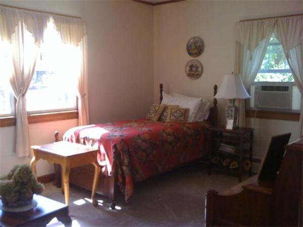 110 Lee Road Deerfield, MA 01373 - Photo 4 of 4 a bedroom with a bed and a window