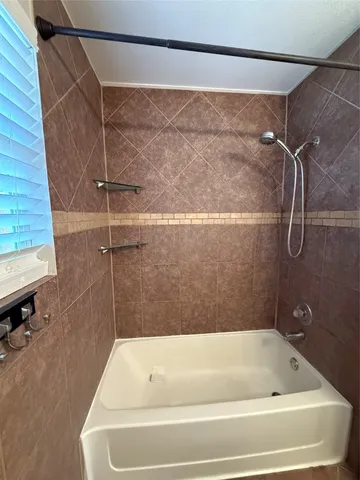 a bathroom with a bath tub