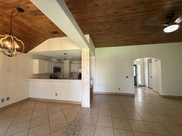 a view of a kitchen with a sink and cabinets