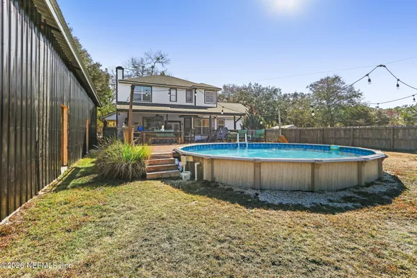 a view of a house with swimming pool