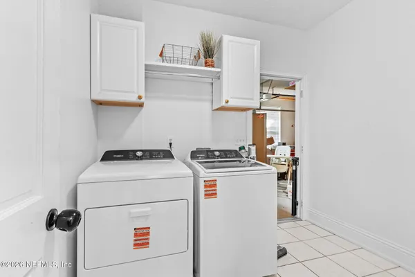 a utility room with dryer and washer