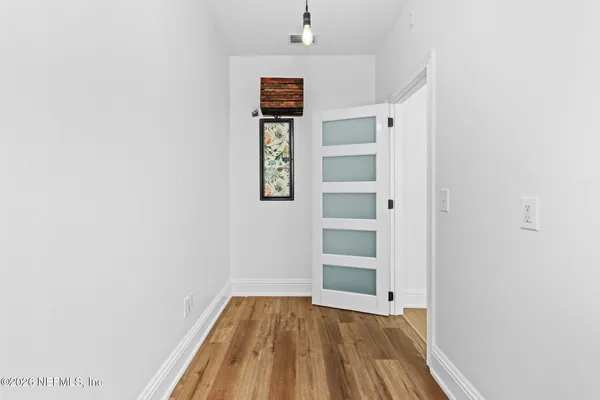a view of empty room with closet
