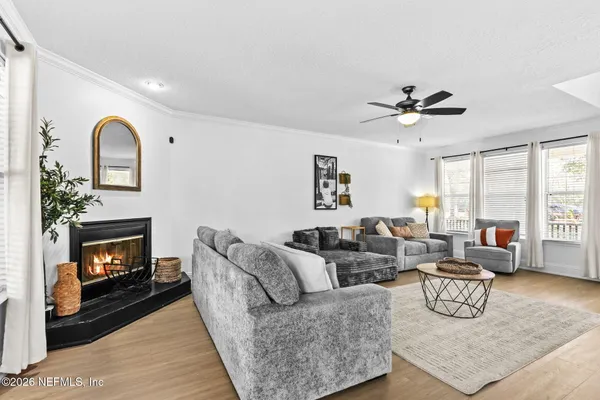 a living room with furniture and a fireplace