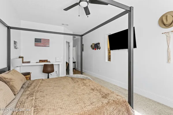 a bedroom with furniture and a bed