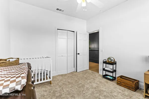 a bedroom with furniture and window