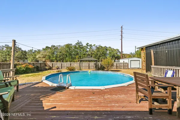a view of a swimming pool with a lounge chairs