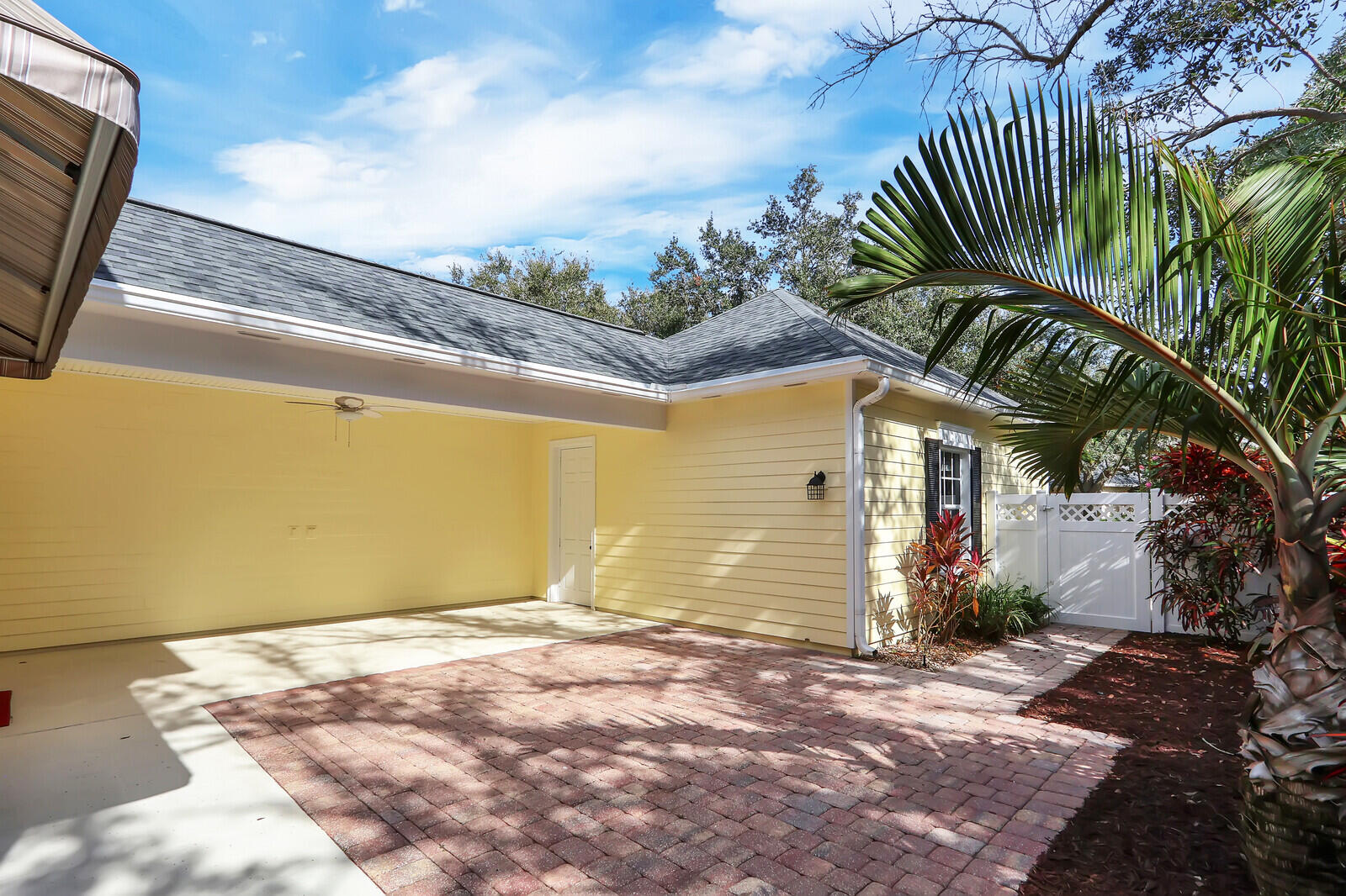 199 Barbados Drive Jupiter, FL 33458 - Photo 32 of 38 a view of a garage with a tree