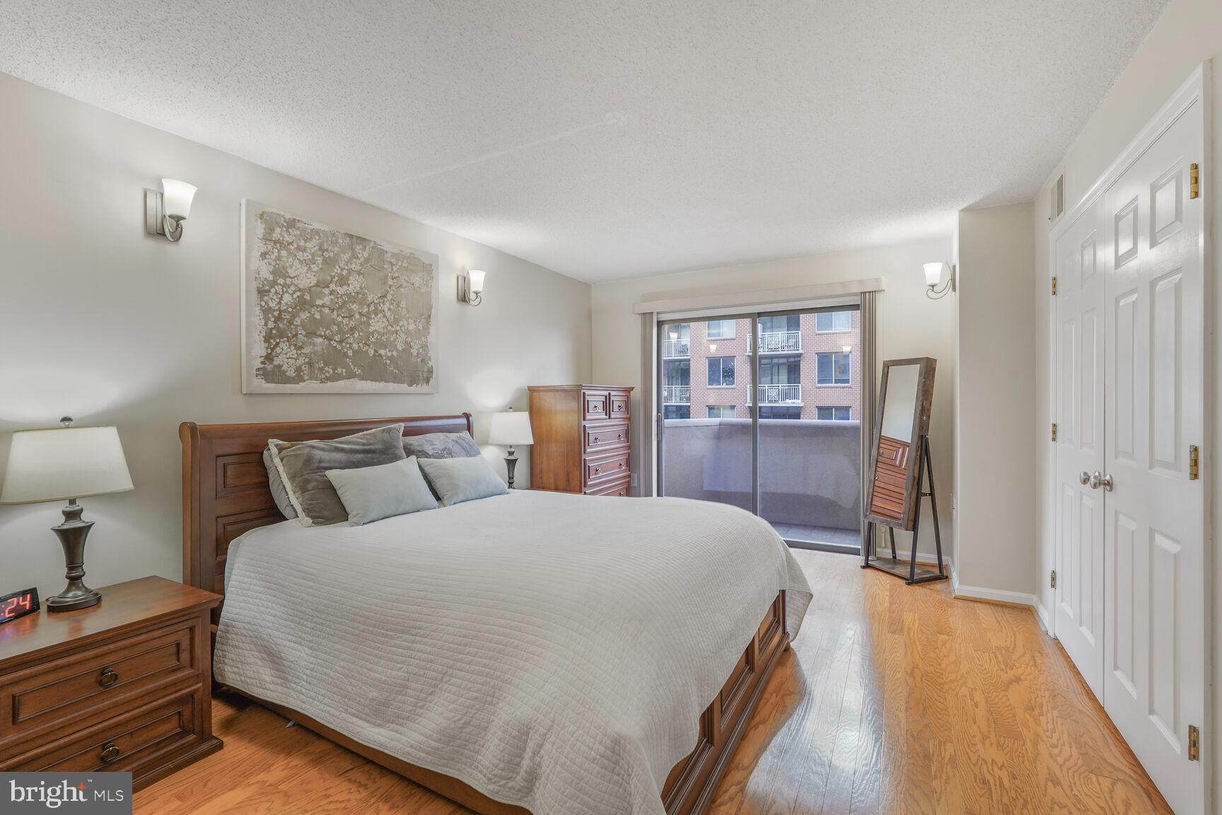 1301 North Courthouse Road, Unit 810 Arlington, VA 22201 - Photo 3 of 31 Primary Bedroom w/ slding doors to balcony