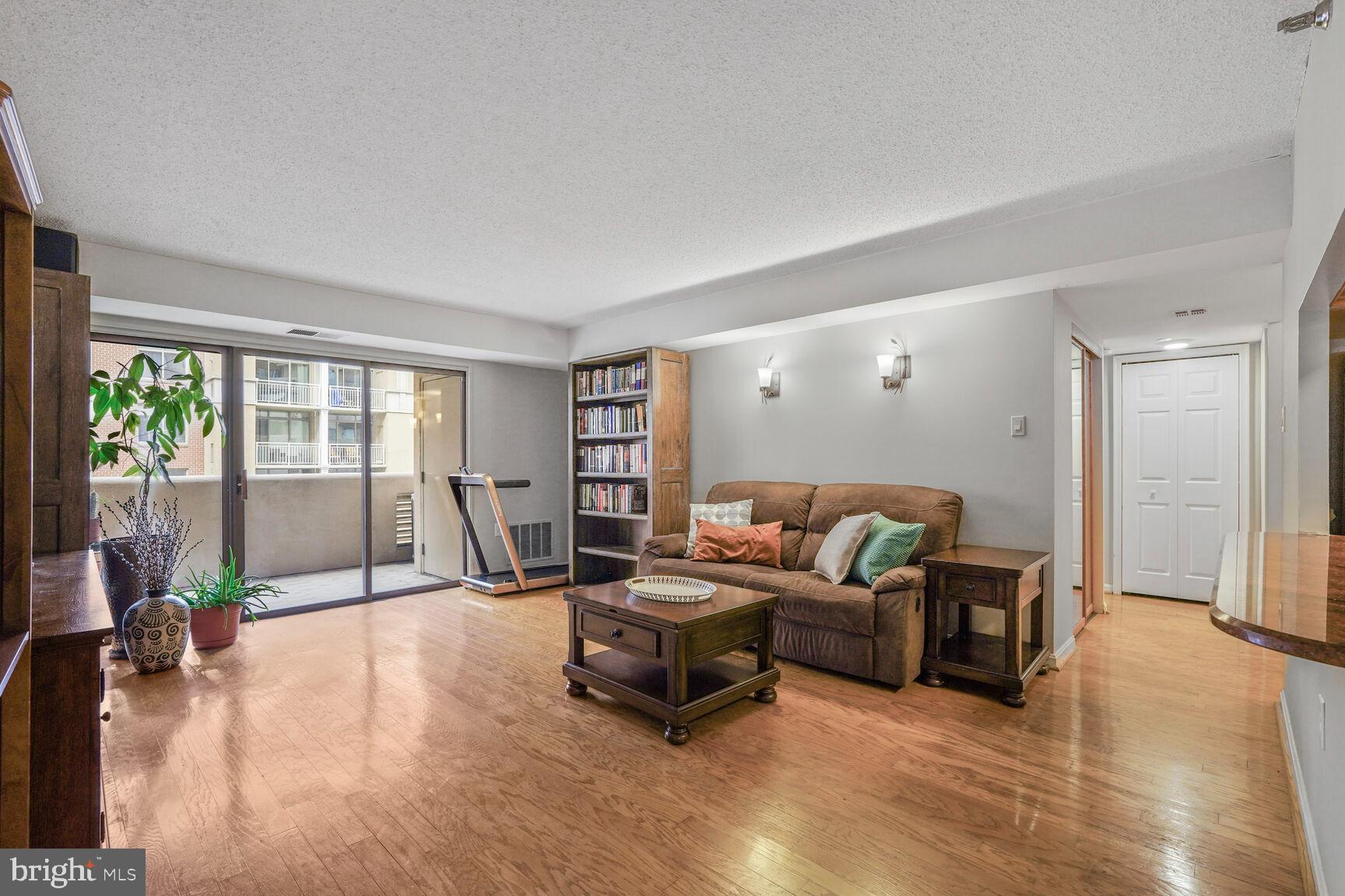 1301 North Courthouse Road, Unit 810 Arlington, VA 22201 - Photo 5 of 31 Living Area with sliding door to balcony.