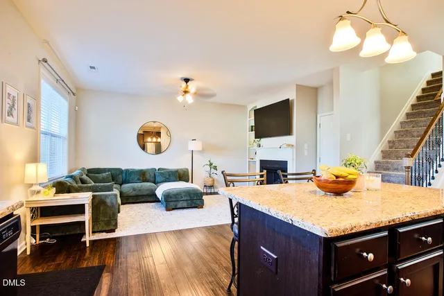 a kitchen with stainless steel appliances granite countertop a stove and a sink