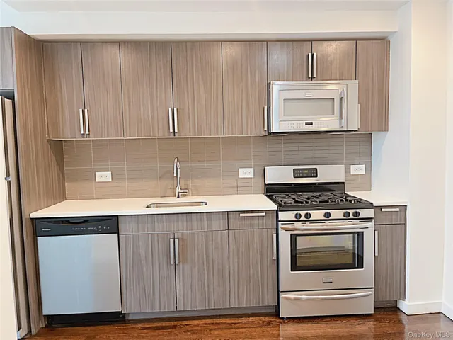 a kitchen with a stove and a sink