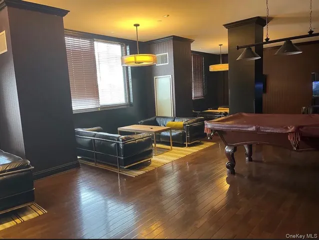 a living room with hard wood flooring and a couch