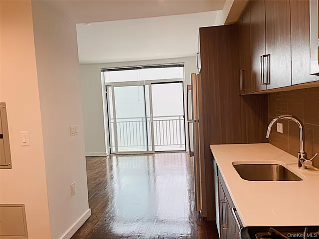 a kitchen with a sink and a refrigerator