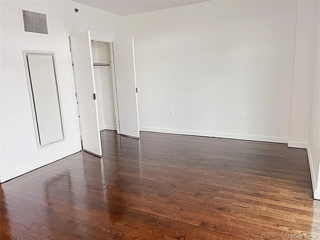 a view of a livingroom with wooden floor