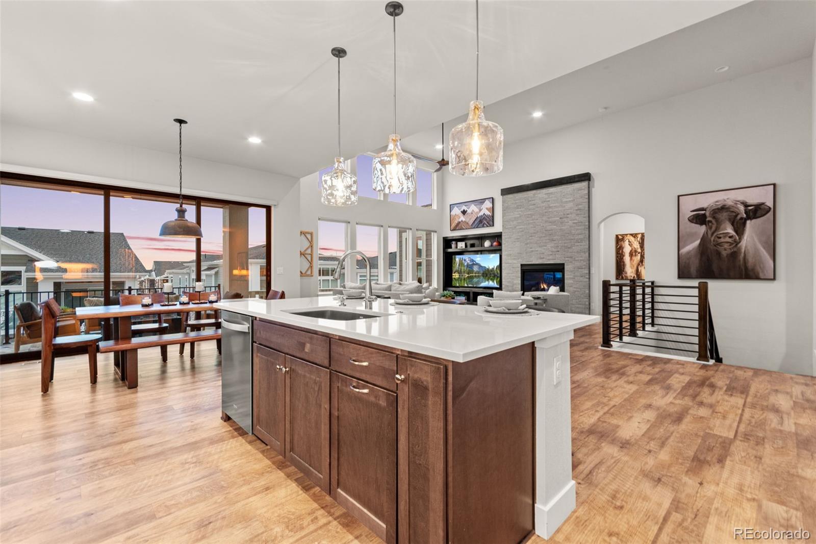 9388 Dunraven Loop Arvada, CO 80007 - Photo 11 of 50 a large kitchen with a table and chairs