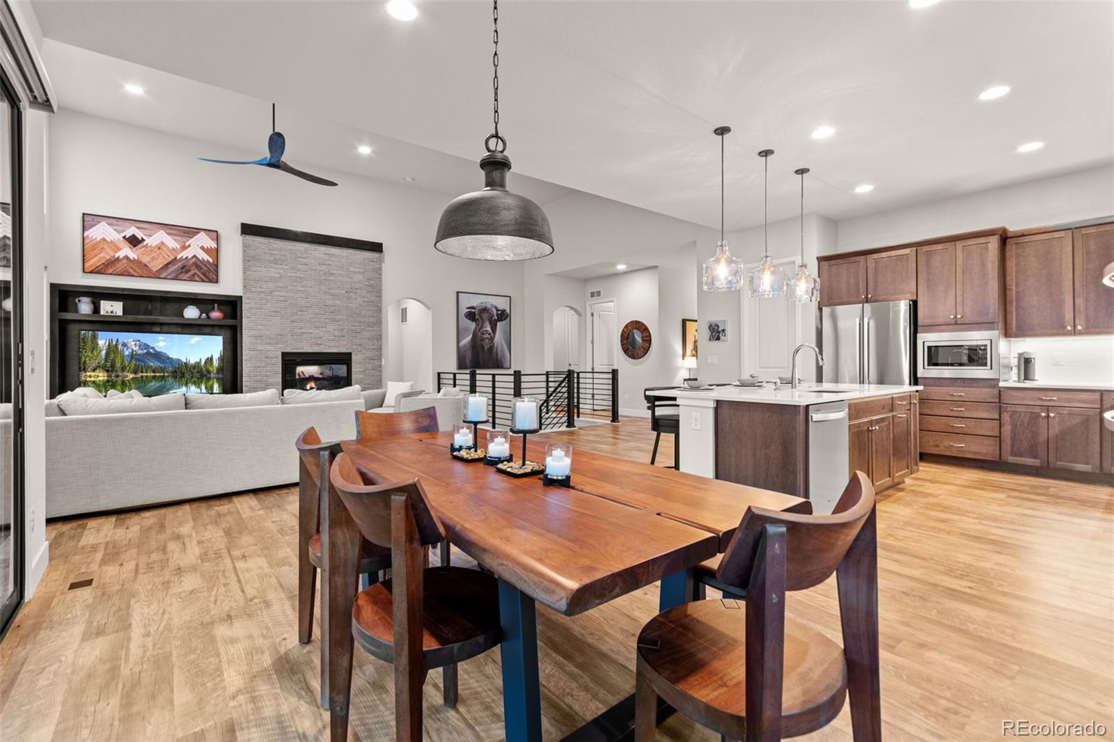 9388 Dunraven Loop Arvada, CO 80007 - Photo 14 of 50 a view of a dining area with furniture and a kitchen view