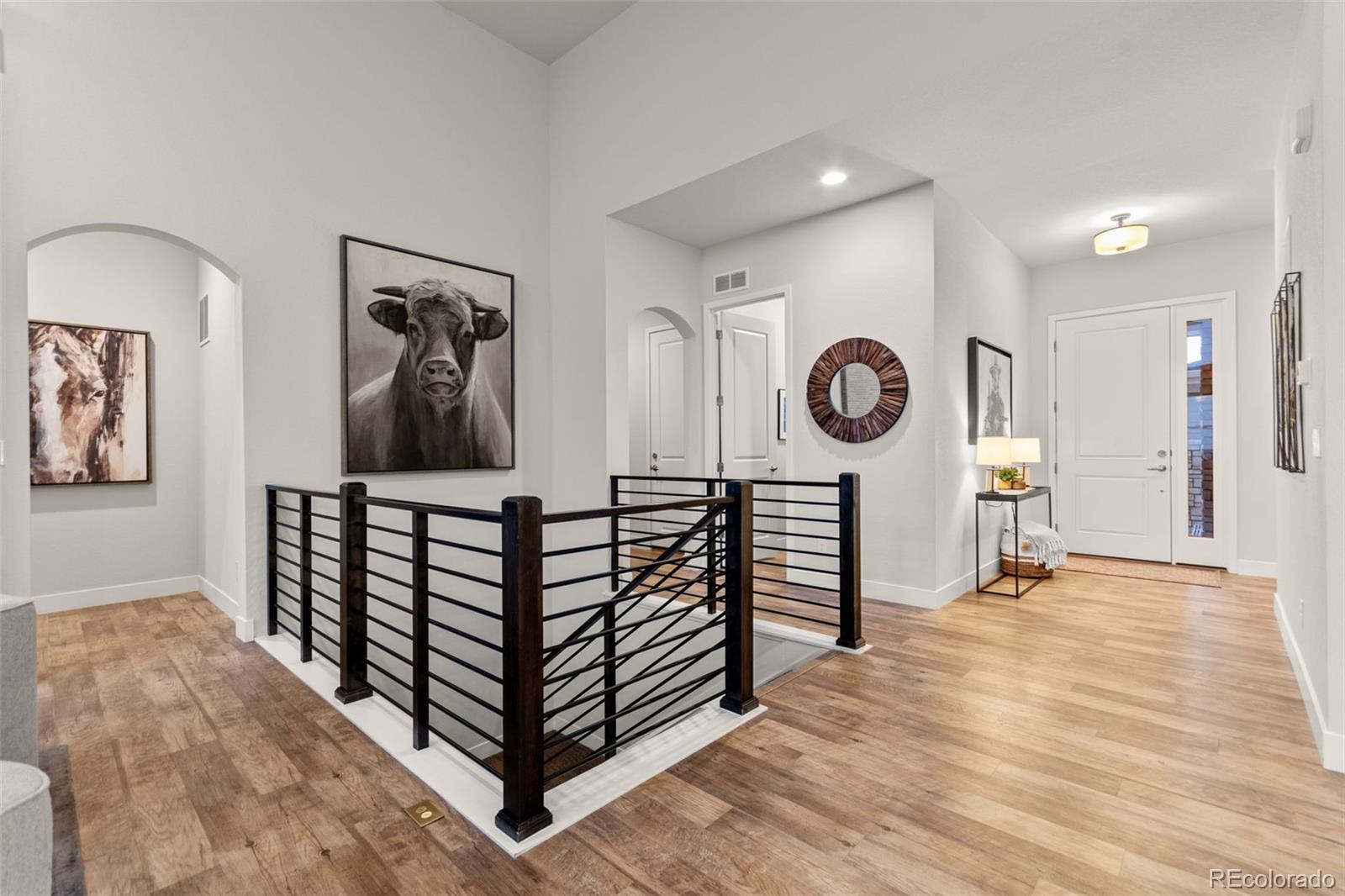9388 Dunraven Loop Arvada, CO 80007 - Photo 17 of 50 a view of a hallway with seating area