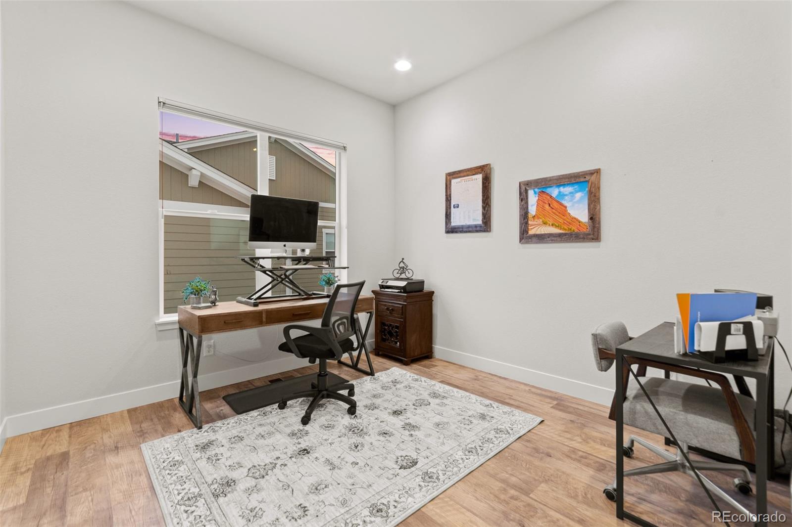9388 Dunraven Loop Arvada, CO 80007 - Photo 27 of 50 a view of a workspace with furniture
