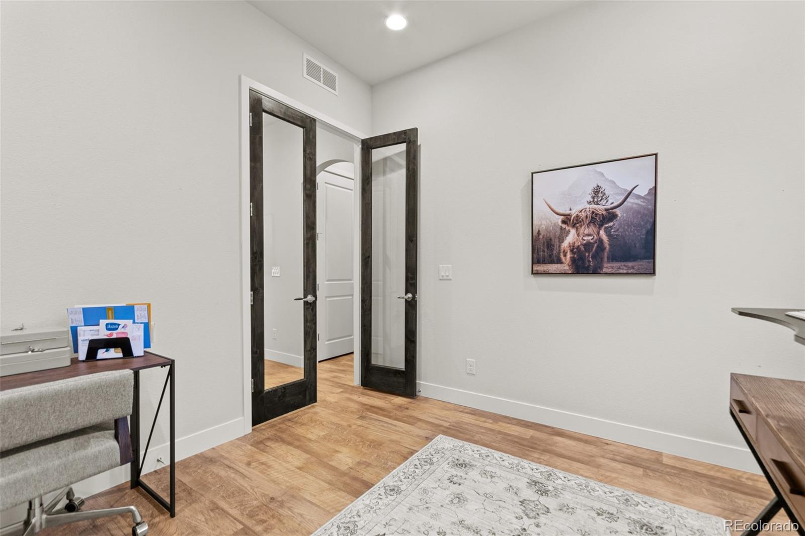 9388 Dunraven Loop Arvada, CO 80007 - Photo 28 of 50 a view of a hallway with workspace